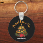 Pretend I Am A Tree Funny Christmas Holiday Key Ring<br><div class="desc">Celebrate the winter season with a touch of irony. This elegant design features a classic decorated Christmas tree with ornaments,  ribbons,  and a poinsettia,  topped with a playful gold script. Ideal for holiday parties and festive gatherings.</div>