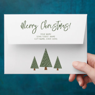 Pretty Christmas envelopes with green pine trees