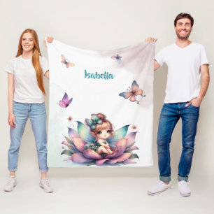 Pretty fairy sitting inside flower fleece blanket