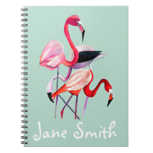 Pretty pink flamingo on blue notebook
