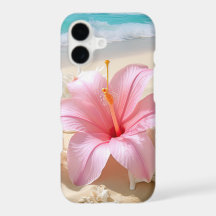 PRETTY PINK HIBISCUS FLOWER ON SANDY BEACH