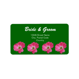 pretty pink wild rose flower in green label