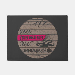 Princess wears hiking shoes, sunset doormat