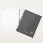 Professional Grey & White Monogram Initial Planner<br><div class="desc">Modern planner features a minimal design in a grey and white colour palette. Custom name presented in the lower right hand corner in simple stylish font with a complimentary minimal monogram medallion. Shown with a custom name and monogram initial on the front in modern typography, this personalised business planner is...</div>