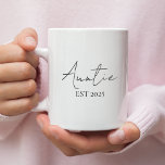 Promoted to Auntie EST 2025 | New Aunt  Coffee Mug<br><div class="desc">Surprise the soon-to-be aunt in your life with this elegant “Promoted to Auntie EST 2025” coffee mug. A perfect gift to celebrate a first-time aunt’s special new role! The minimal script design adds a modern, heartfelt touch—great for pregnancy announcements, baby showers, or just because. Ideal for morning coffee, tea, or...</div>