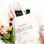 Promoted to Grandma EST 2025  | Pastel Gift Tote Bag<br><div class="desc">Celebrate the sweetest promotion ever with this minimalist "Promoted to Grandma EST 2025" personalised tote bag! Featuring soft pastel lettering and a clean, modern design, this reusable cotton tote is perfect for grocery runs, baby visits, or simply showing off that exciting new grandma status. Customise the year or name for...</div>