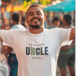 Promoted to Uncle EST 2025 | New Uncle T-Shirt<br><div class="desc">Let him wear his new title with pride! This “Promoted to Uncle EST 2025” T-shirt is the perfect way to celebrate a fun family milestone. Designed in soft pastel tones with a clean, modern style, it’s great for pregnancy announcements, gender reveals, baby showers, or just letting the world know he’s...</div>