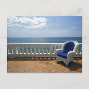 Puerto Rico. Wicker chair and tiled terrace at Postcard