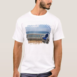 Puerto Rico. Wicker chair and tiled terrace at T-Shirt