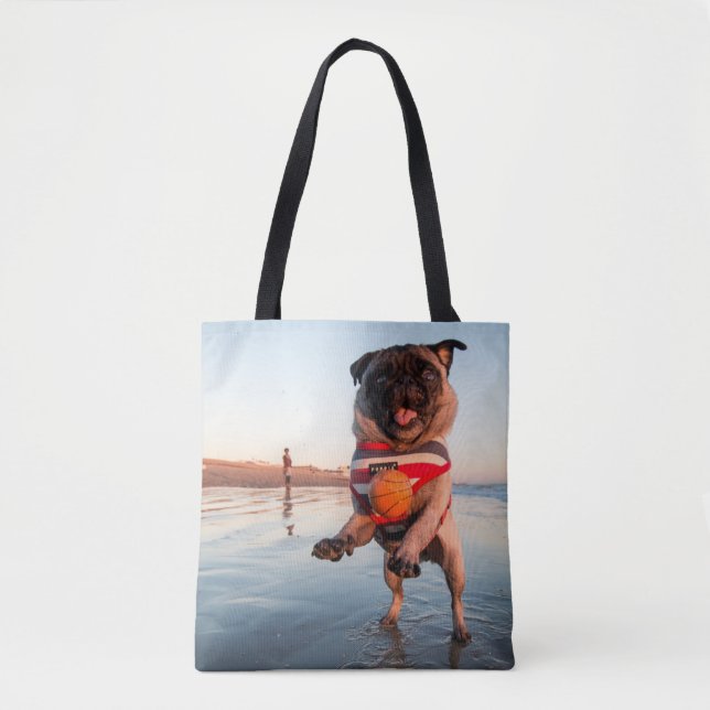 Pug Playing Ball on Beach Tote Bag (Front)