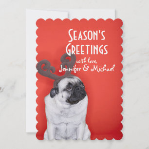 Pug wearing reindeer antlers