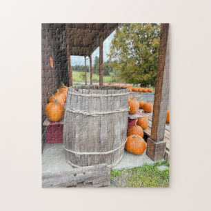 Pumpkins and barrel by a farm jigsaw puzzle