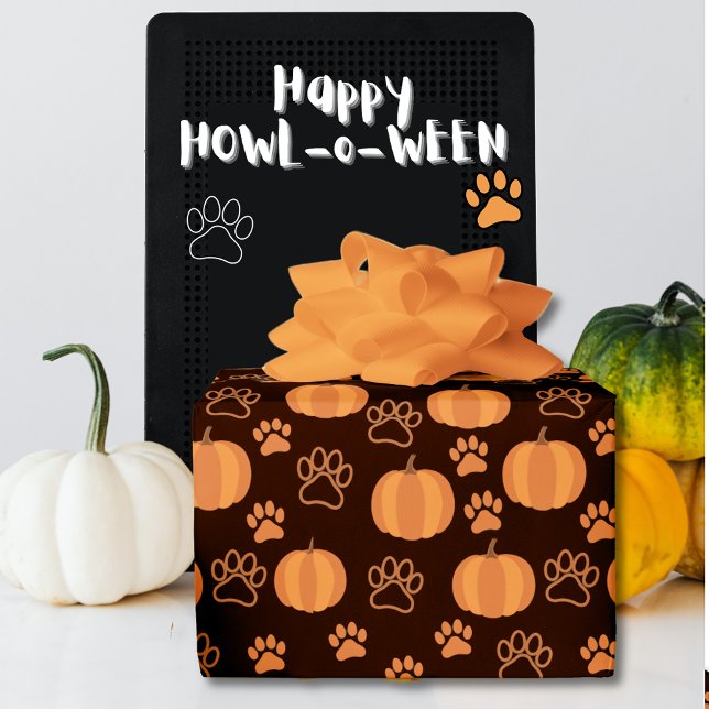Pumpkins and Paws Halloween Wrapping Paper (Happy Howl-o-Ween gift with pumpkins and paws orange on black wrapping paper.)