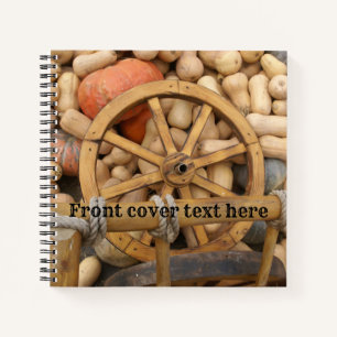 Pumpkins and Wheel of the rural wooden cart Notebook