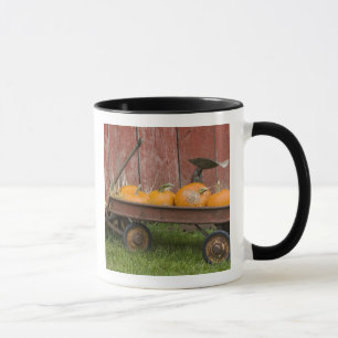 Pumpkins in old wagon mug