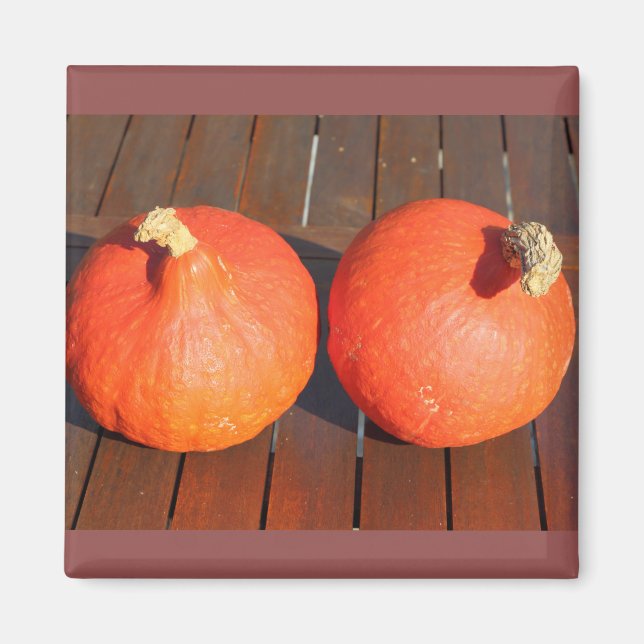 Pumpkins on a wooden table magnet (Front)