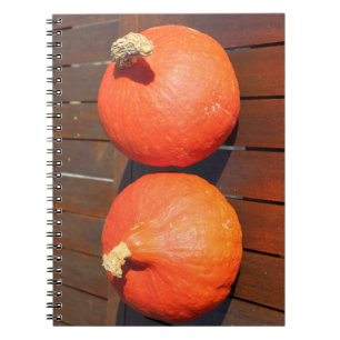 Pumpkins on a wooden table notebook
