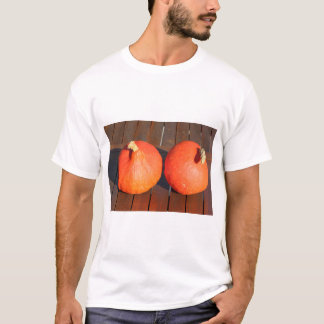 Pumpkins on a wooden table T-Shirt