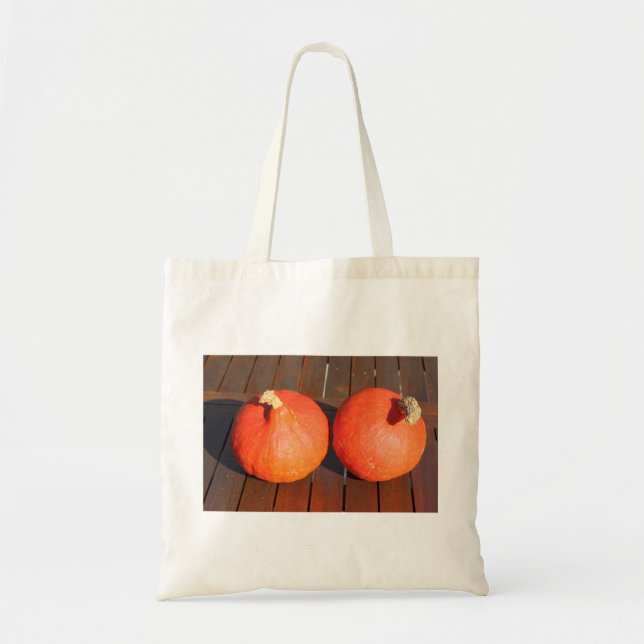 Pumpkins on a wooden table tote bag (Front)