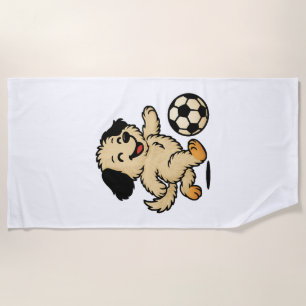 Puppy playing Soccer Beach Towel