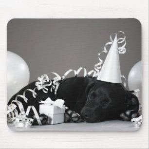 Puppy sleeping in party decorations mouse pad