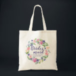 Purple and Pink Floral Personalised Bridesmaid Tote Bag<br><div class="desc">A beautiful wedding welcome gift for your bridesmaids. Pink and purple watercolor flowers look fabulous with the modern greenery. Bridesmaid is written in a flowing purple script. The bride's name wedding and the wedding date is below. All of the template text can be easily changed. You can also change the...</div>