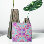 Purple And Turquoise Ethnic Kaleidoscopic Pattern Tile<br><div class="desc">Introducing an exquisite ceramic tile adorned with an intricate and captivating design. This ornate masterpiece showcases a harmonious blend of abstract shapes seamlessly interwoven, presenting a mesmerising pattern. Vibrant hues of purple, beige, and turquoise entwine gracefully, imbuing a sense of elegance and allure. Elevate your space with this decorative tile,...</div>