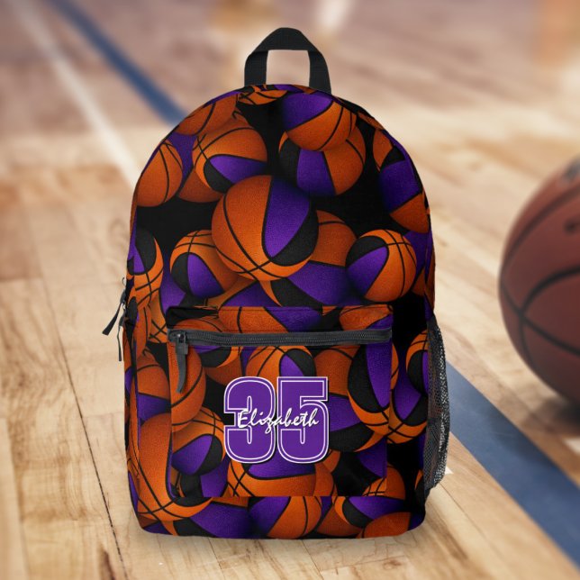 Purple black basketball team colours player name  printed backpack (Team colors basketballs pattern backpack on gymnasium floor)
