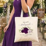 Purple Boho Roses Elegant Bridesmaid Wedding Favou Tote Bag<br><div class="desc">These beautiful tote bags are a wonderful way to thank your bridesmaids for being part of your wedding party. They feature a lovely boho chic floral design with a cluster of hand painted watercolor roses in shades of purple, plum, and lavender, surrounded by sprigs of eucalyptus leaves and garden greenery....</div>