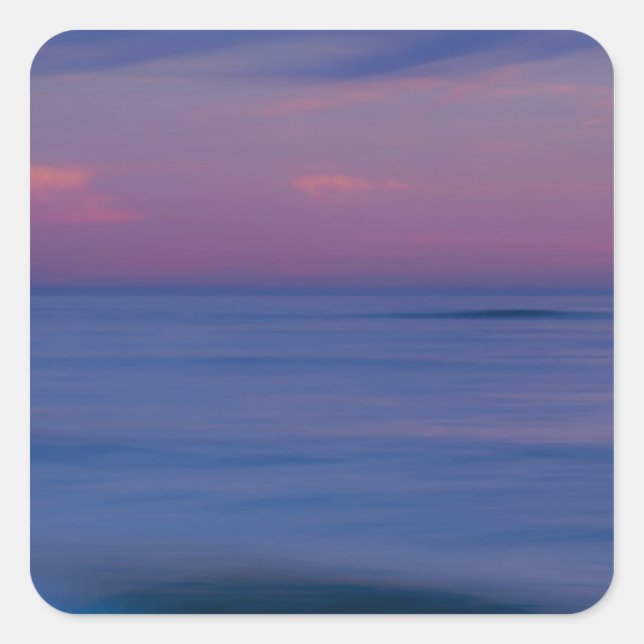 Purple-coloured sunrise on ocean shore square sticker (Front)