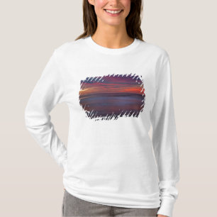 Purple-coloured sunrise on ocean shore T-Shirt