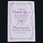 Purple Coquette Bow Pastel Bridal Shower Favour Medium Gift Bag<br><div class="desc">Add a touch of playful charm to your celebration with our Coquette Bow Party Decor Collection. Featuring a hand-drawn coquette bow doodle on a dreamy pastel striped background, this grandmillennial-inspired design is perfect for creating a soft, sweet party scene. The pastel purple palette and whimsical bow details bring a feminine...</div>