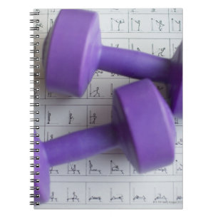 Purple dumbbells. spiral notebook