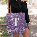 Purple Faux Glitter Bokeh Sparkles Monogrammed Tote Bag<br><div class="desc">A modern bold single letter monogram in white with a black drop shadow. The font size, colour and style are customisable. The background is a faux purple glitter with sparkly spots or bokeh. Move or delete the tiny faux sparkle graphics. A nice gift for a bridesmaid or other member of...</div>