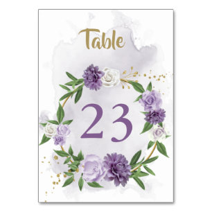 purple flowers greenery wreath table number