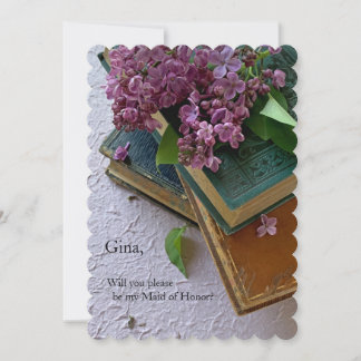 Purple flowers on vintage books announcement