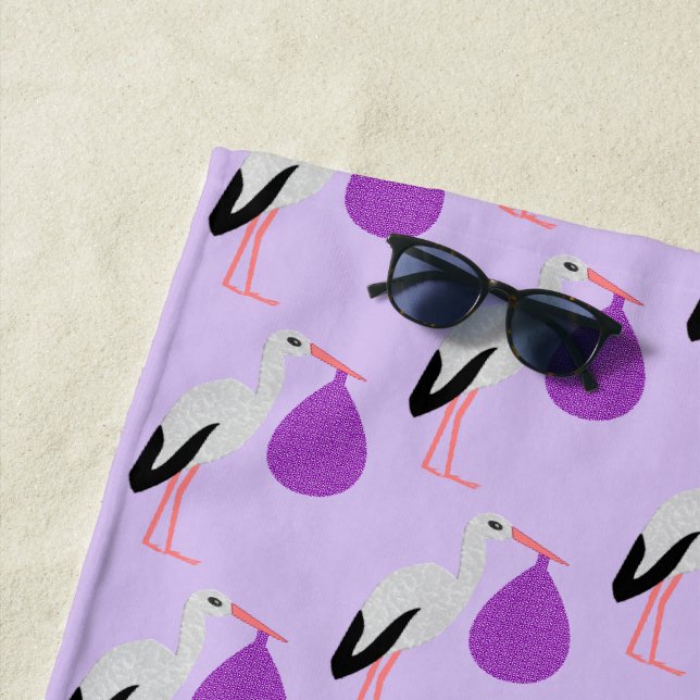 Purple gender neutral Baby Stork Patterned Beach Towel (In Situ)