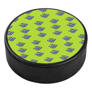 Purple grapes pattern on green hockey puck