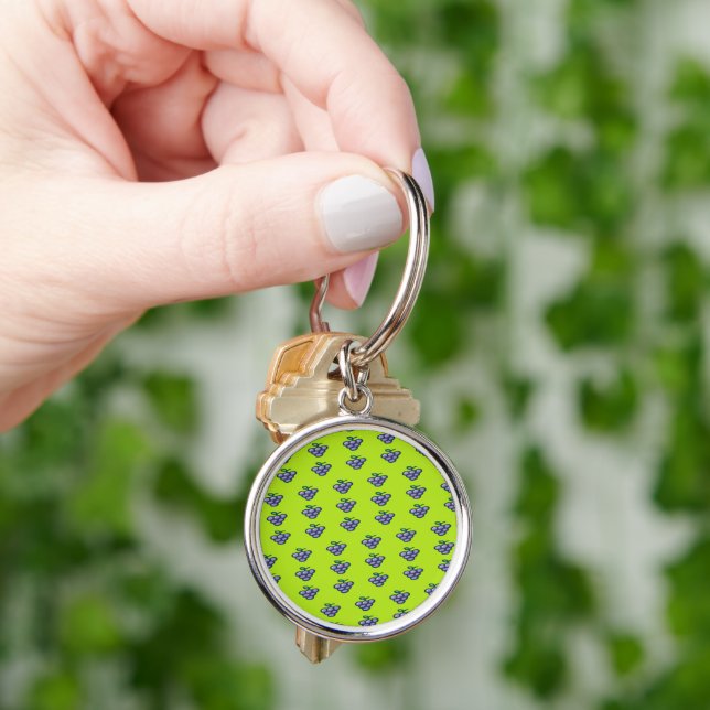 Purple grapes pattern on green key ring (Hand)