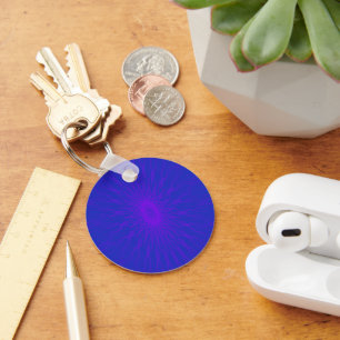 Purple mandala rays on blue keychain