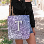 Purple Ombre Chunky Glitter Monogrammed Tote Bag<br><div class="desc">A modern bold single letter double layer monogram in white with a black drop shadow. The font size, colour and style are customisable. The background is a faux lavender, purple and periwinkle gradient glitter with sparkly spots or blurry bokeh. Move or delete the tiny faux sparkle graphics. A nice gift...</div>