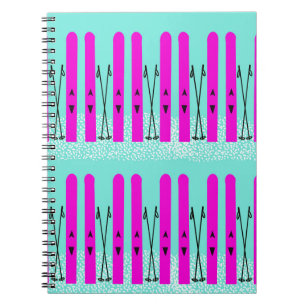 Purple skis on blue notebook