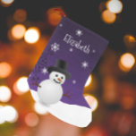 Purple Snowman Winter Scene Christmas Stocking<br><div class="desc">Add a whimsical touch to your mantle this holiday season with a personalised Purple Snowman Winter Scene Christmas Stocking. Stocking design features a happy snowman in a snowy wintry scene against a purple background adorned with matching colour snowflakes. Additional gift and holiday items available with this design as well.</div>