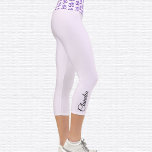 Purple Space Om Symbol High Waisted Capri Leggings<br><div class="desc">Purple space pattern Om symbol is tiled on the waistband, the capri leggings are white magnolia. Name in black on outside of right calf. Easily change or remove name using the Template provided. There is ample room for a full name or other text. Sizes from XS (0-2) to XL (16)...</div>