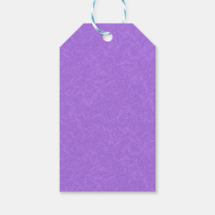 Purple textured surface with swirling pattern gift tags