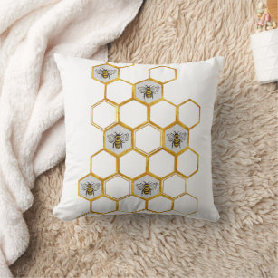 Queen bee pattern in gold honeycomb hexagons cushion