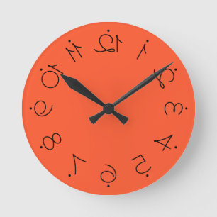 Quirky Orange With Flipped Twisted Numbers Round Clock