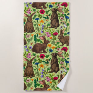 Rabbits and wildflowers on honeydew green beach towel
