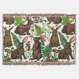 Rabbits and woodland flora Throw Blanket