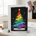 Rainbow Christmas Tree LGBTQ Pride Holiday Art Card<br><div class="desc">Rainbow Christmas Tree LGBTQ Pride Holiday Art features a bright rainbow tree with ornaments, snowflakes, and a gold star on a black background. The colourful design blends festive Christmas style with a bold Pride theme for a cheerful seasonal look. Its vivid rainbow palette makes the artwork stand out while keeping...</div>